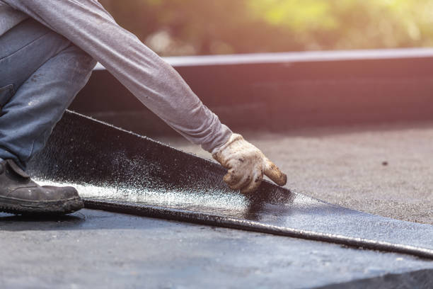 Professional Waterproofing technician working in Glenwood, NY